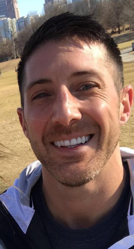 Robert DeRosa smiling outdoors